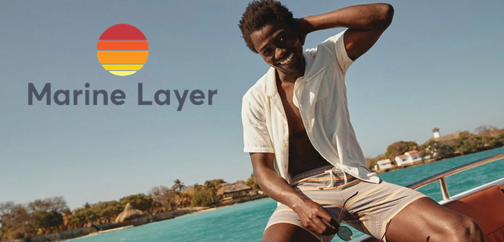 Merch Outfitters - Example Image of Branded Corporate Goods & Branding Items - Marine Layer logo and man on boat wearing shirt