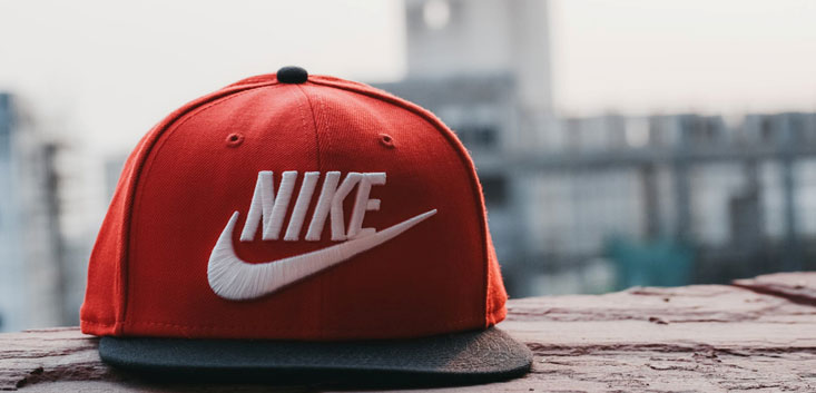 Merch Outfitters - Example Image of Branded Corporate Goods & Branding Items - Nike branded cap atop ledge
